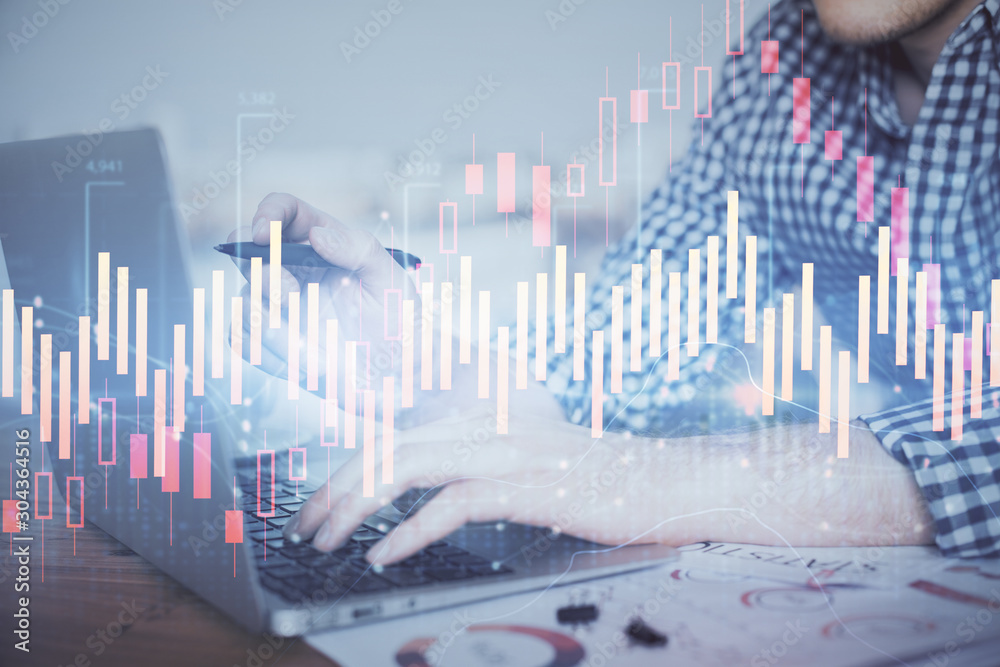 Double exposure of forex graph with man working on computer on background. Concept of market analysis.