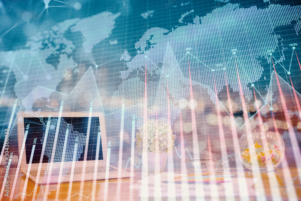 Forex graph hologram on table with computer background. Double exposure. Concept of financial markets. Forex graph hologram on table with computer background. Double exposure. Concept of financial markets.