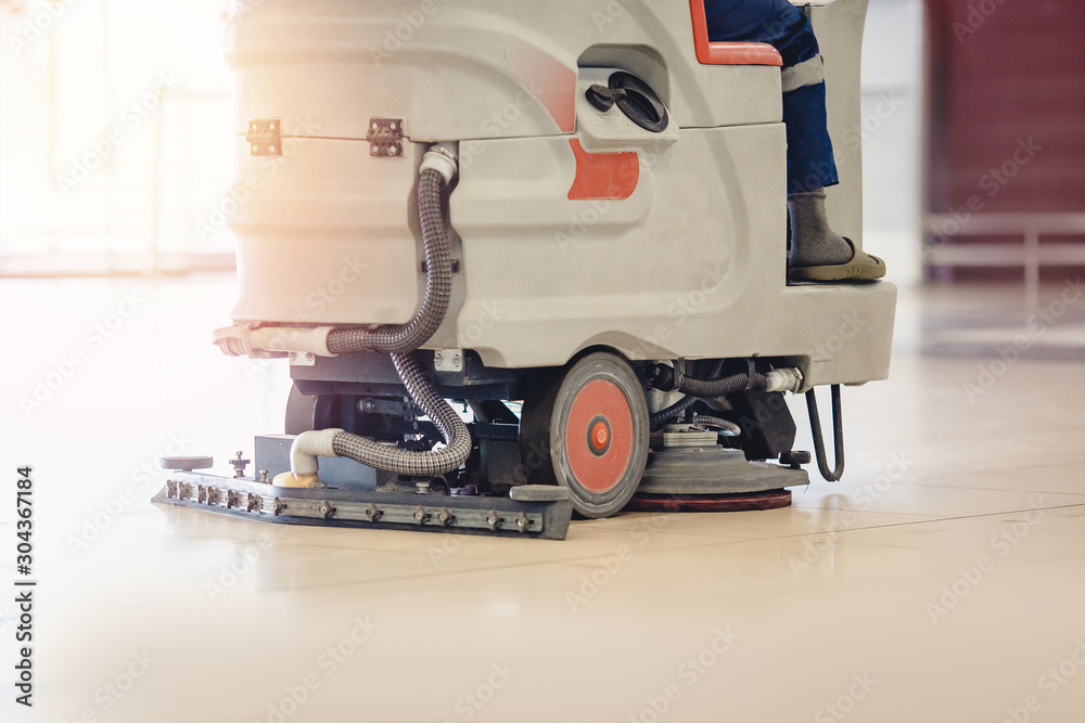 Fototapeta premium Close-up sweeper machine cleaning. Concept clean airport from debris