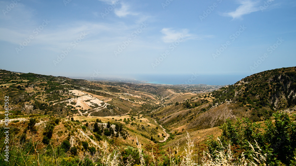 mountain landscape in cyprus, mediterranean sea on the horizon mountain landscape in cyprus, mediterranean sea on the horizon
