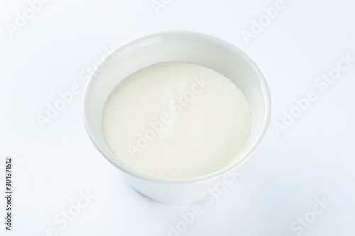 mayonnaise in a bowl on a light background