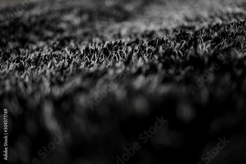 Closeup of Black Synthetic Fabric Texture Background. Selective focus