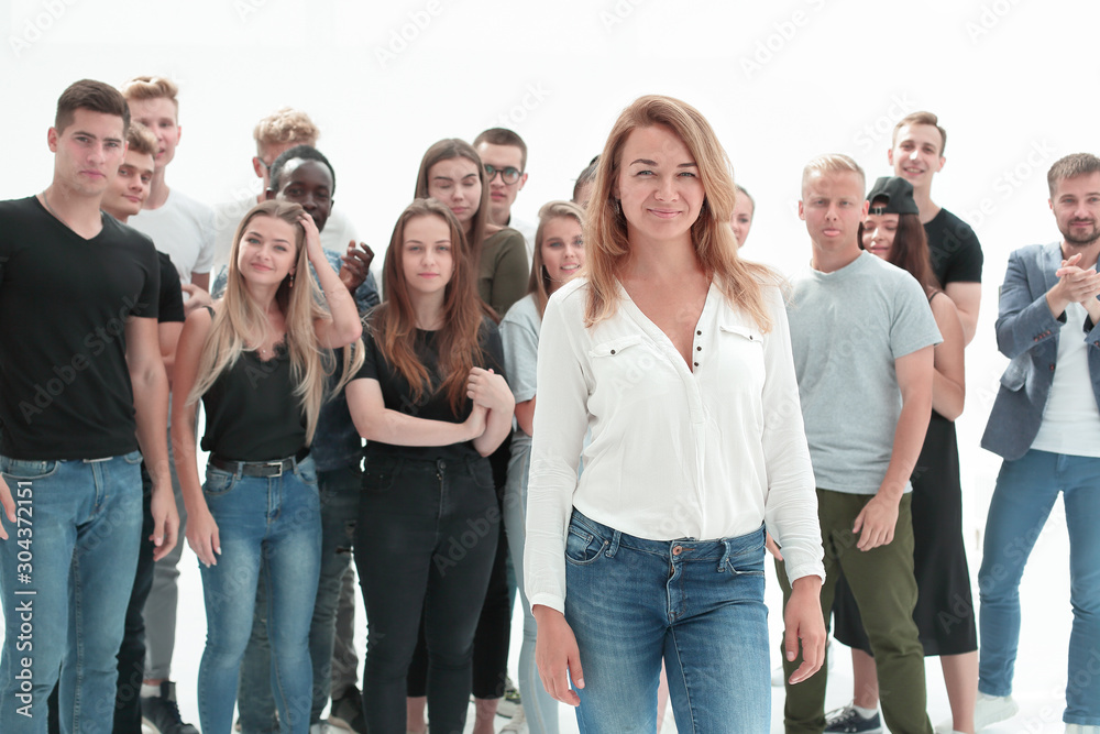 Fototapeta premium confident young woman leader standing in front of her associates