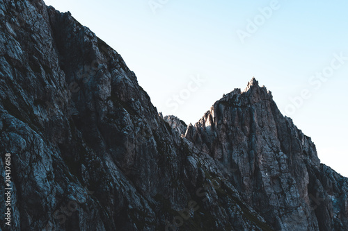 Breathtaking Views From Mangart Peak at Stunning Sunrise. Peaks Above Clouds.