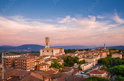 Panoramic view Perugia huge and iconic St Dominic Basilica and Umbria countryside with sunset colors