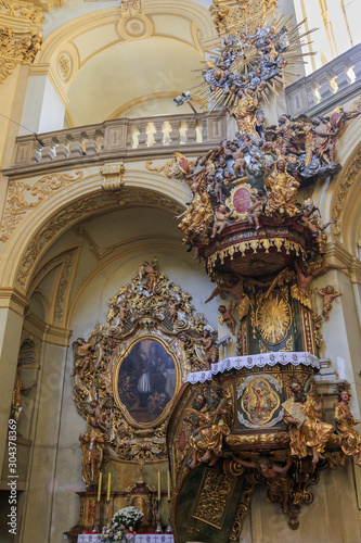 Interior of Basilica in Wambierzyce, Poland. Decorated pulpit photo