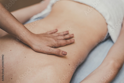 Wallpaper Mural Medical massage of the spine. Masseur massages a teenager in a clinic Torontodigital.ca