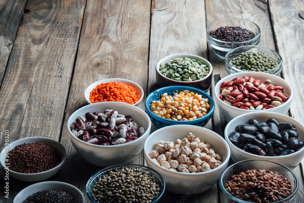 Super food. Seeds and beans assortment on a rustic background copy space. Vegetarians.