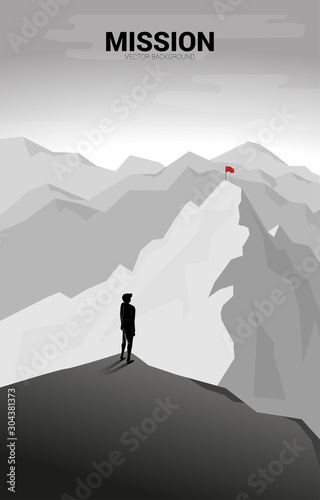 Businessman and Flag on far away mountain. Concept of Goal, Mission, Vision, Career path