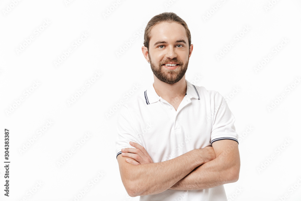 Bearded man posing isolated over white wall background.