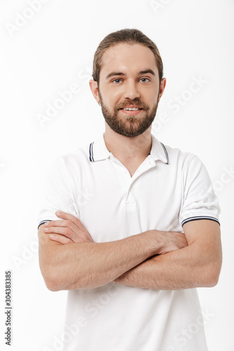 Bearded man posing isolated over white wall background. © Drobot Dean