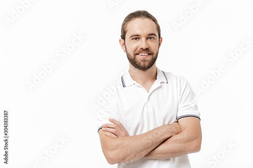 Bearded man posing isolated over white wall background. © Drobot Dean