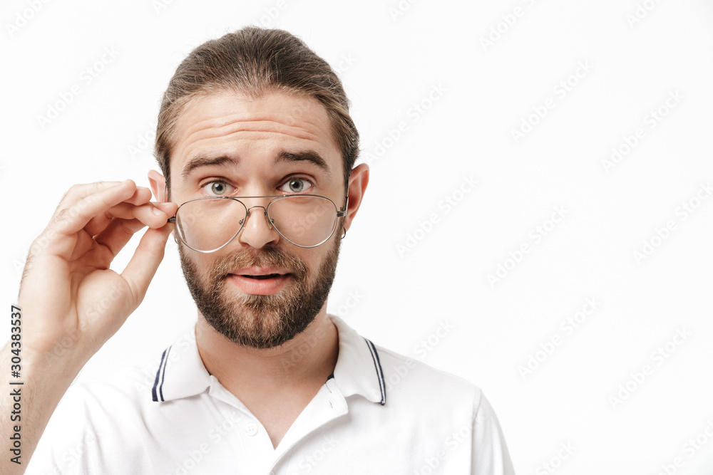 Attractive young bearded man wearing casual outfit standing