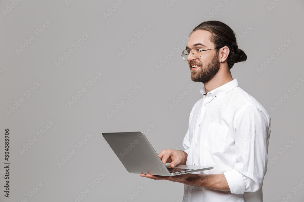 Man posing isolated over grey wall background