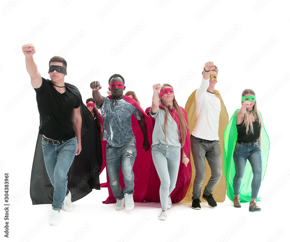 Fototapeta premium confident team of superheroes walking behind their leader