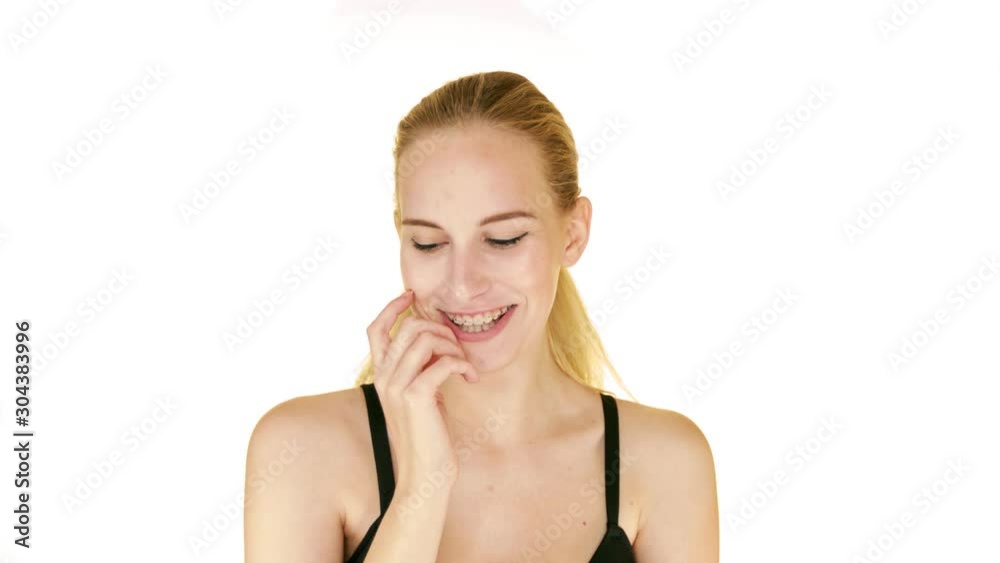 Beautiful model with clean skin touching her face. Isolated on white studio backgroud. Beautiful model with clean skin touching her face. Isolated on white studio backgroud.