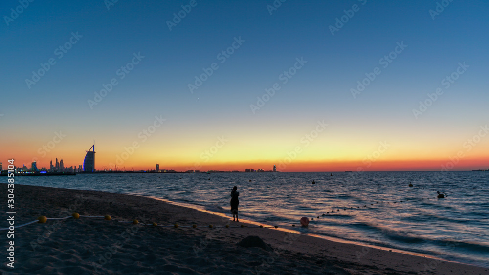 Blue hour sunset at the beach in Dubai showing amazing skyline