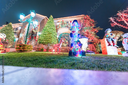 DYKER HEIGHTS, NEW YORK - DECEMBER 6, 2018 - Christmas Lights in Dyker Heights district. It is the cutest small area of houses  decorated for the holiday season in the Brooklyn Metropolitan Area photo