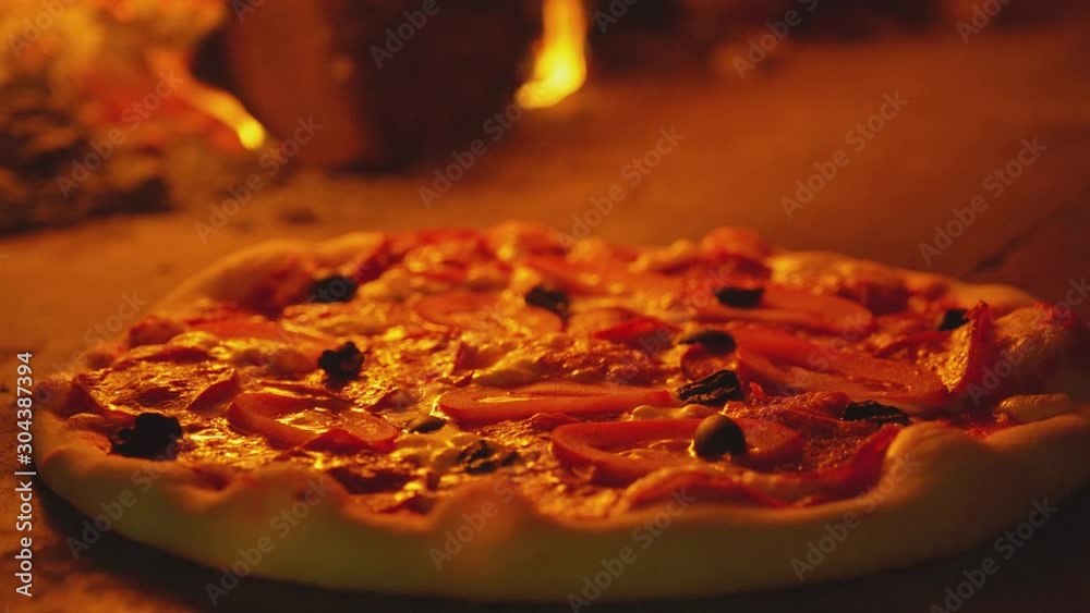 Pizza in the oven. Close up of a cheese on pizza melts from oven heat. Italian pizza