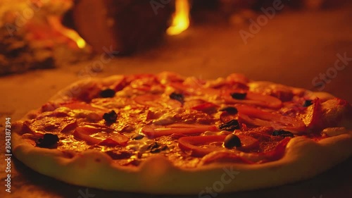 Pizza in the oven. Close up of a cheese on pizza melts from oven heat. Italian pizza