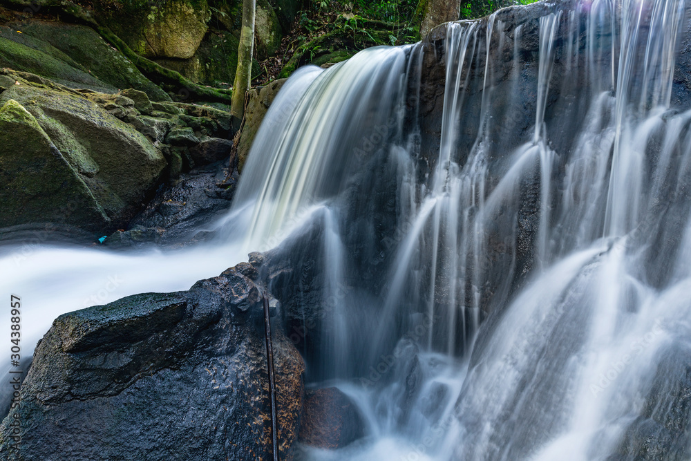 Obraz premium Amazig Waterfall at the Secret Buddha Garden on Ko Samui, Thailand