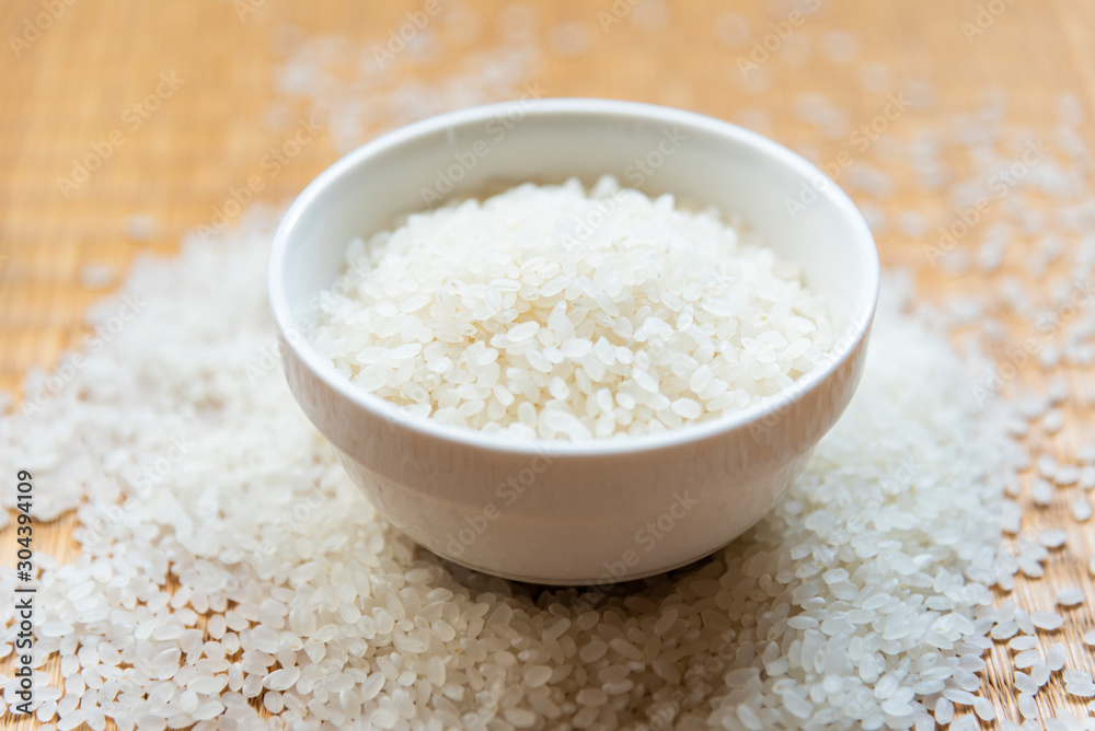 Beautiful japanese rice on japanese mat,round rice grain Beautiful japanese rice on japanese mat,round rice grain