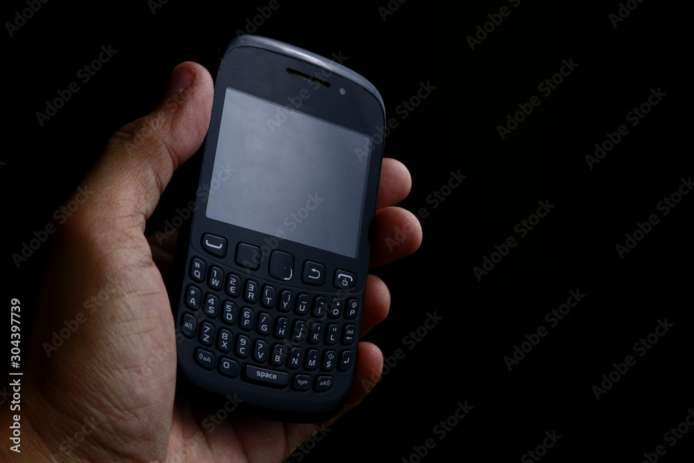 Old and used mobile phone with qwerty keyboard Old and used mobile phone with qwerty keyboard
