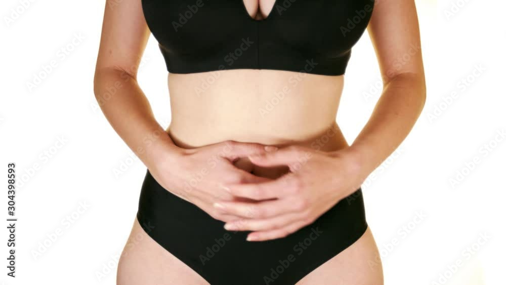 Woman touching stomach painful suffering from stomachache causes of menstruation period, gastric ulcer, appendicitis or gastrointestinal system disease. Healthcare and health insurance concept. Woman touching stomach painful suffering from stomachache causes of menstruation period, gastric ulcer, appendicitis or gastrointestinal system disease. Healthcare and health insurance concept.
