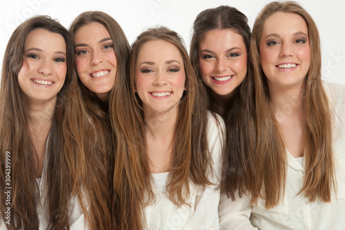 studio portrait of 5 happy teenage girls  photo