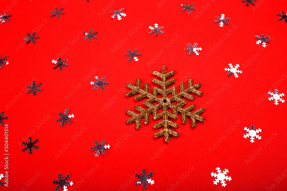 Festive red background with silver snowflake and white star. Flat lay, top view. 2020 New Year Concept Festive red background with silver snowflake and white star. Flat lay, top view. 2020 New Year Concept