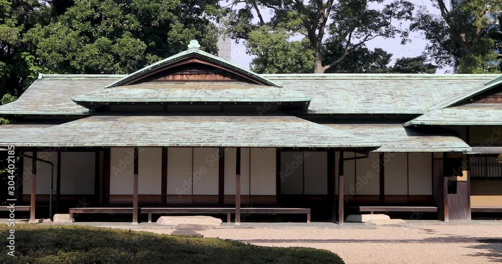 Traditional oriental building located near path on sunny day in Asian park Traditional oriental building located near path on sunny day in Asian park