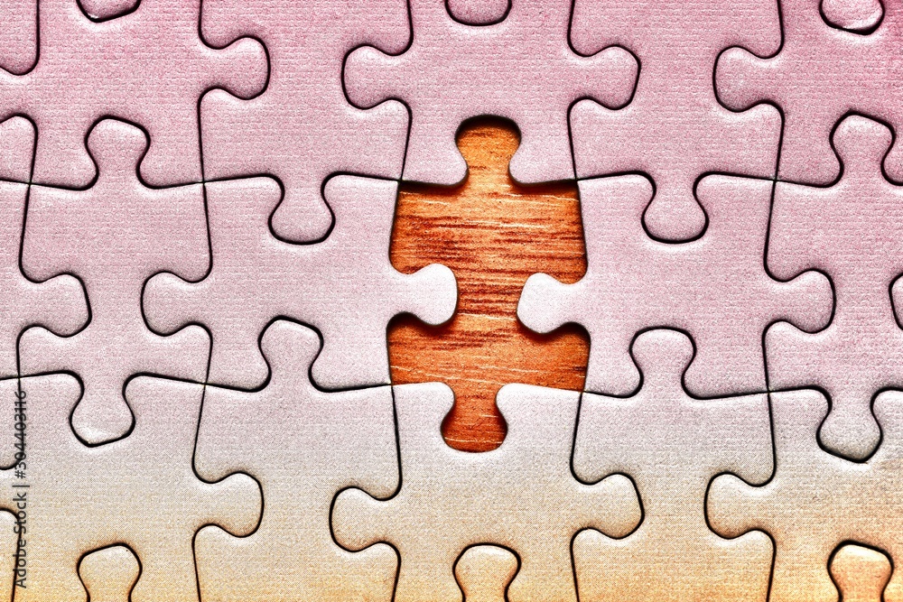 Jigsaw puzzle background, one last piece missing only, almost complete Jigsaw puzzle background, one last piece missing only, almost complete