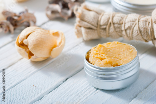 organic skin care butters from, shea, macadamia nut, coffee, mango, and cosmetic clay, mud on white wooden