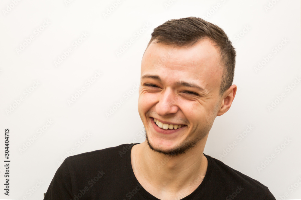 Obraz premium emotion sweat smile, young man on a white background, human emoji