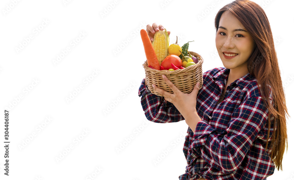 Healthy young woman with fresh organic vegetable in basket while looking at camera isolated on white background. Lifestyle vegetarian concept. Healthy young woman with fresh organic vegetable in basket while looking at camera isolated on white background. Lifestyle vegetarian concept.