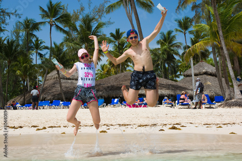 Happy teenagers keeping in ...