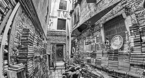 VENICE - APRIL 10, 2014: Acqua Alta library with old books collection is a famous tourist attraction