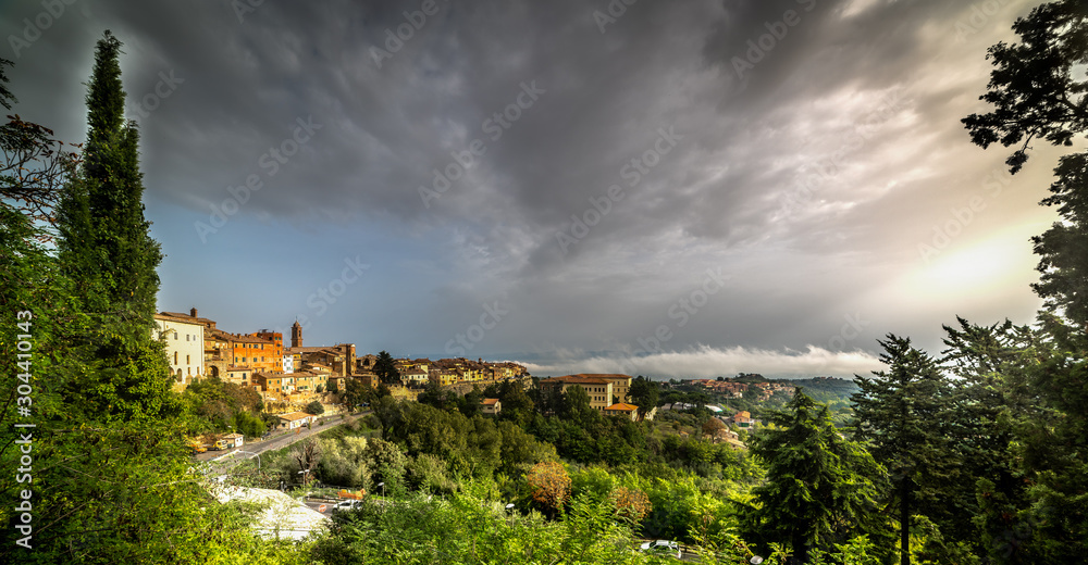 Montepulciano under a cloudy sky at sunset