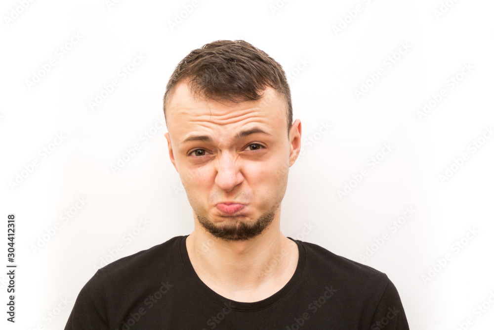 emotion slightly frowining face, young man in a black cap on a white background, man emoji emotion slightly frowining face, young man in a black cap on a white background, man emoji