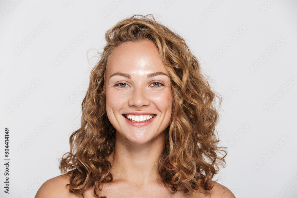 © Drobot Dean - Image of happy half-naked woman smiling and looking at camera