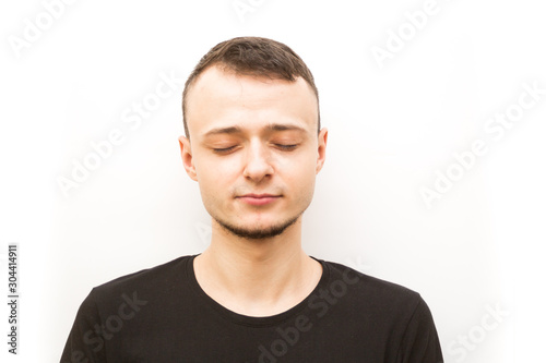 emotion relived, young man in a black cap on a white background, man emoji