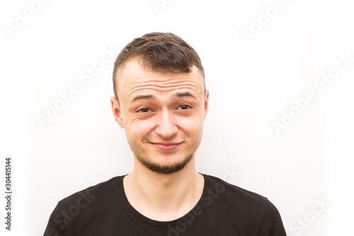 emotion smirk, young man in a black cap on a white background, man emoji