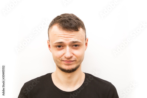 emotion not amused, young man in a black cap on a white background, man emoji