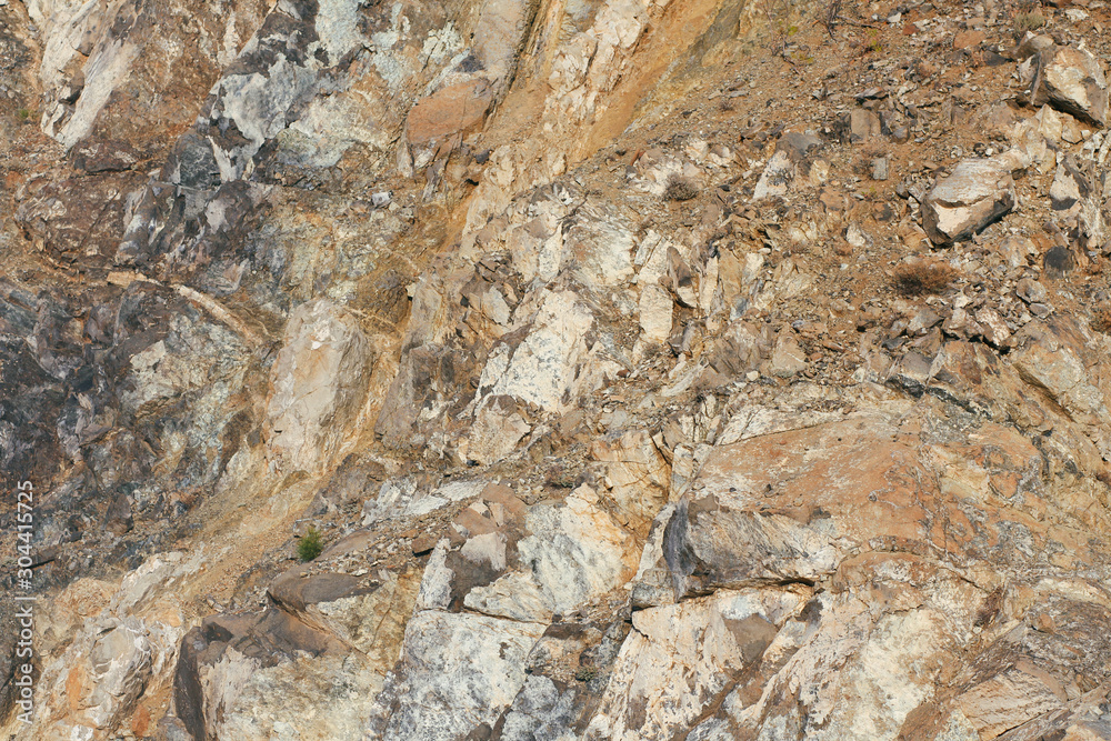 Naklejka premium Concrete wall texture background. Natural stones. Building's facade decor. Decorative plaster. House exterior. 