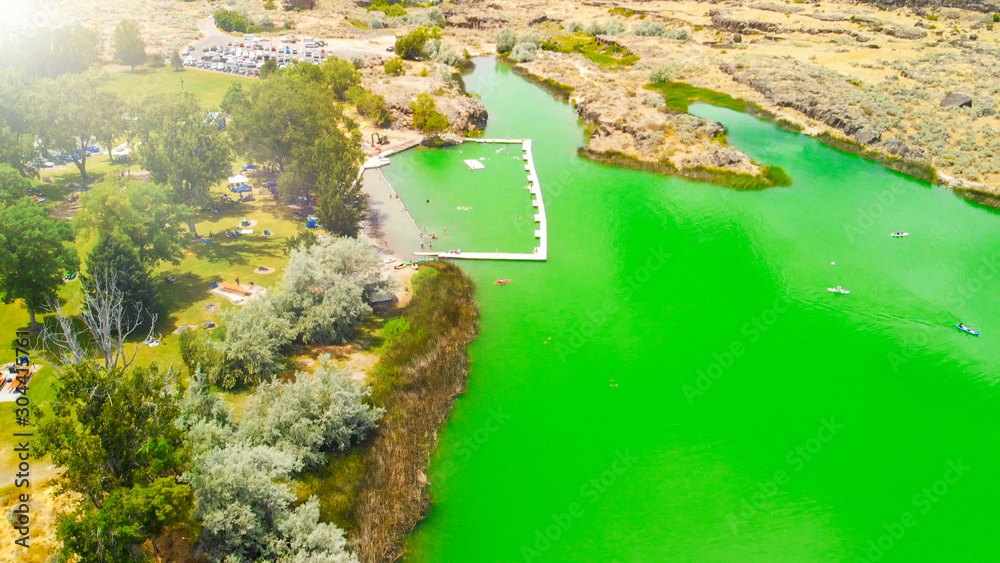 Dierkes Park Lake in summer on a beautiful sunny day, Twin Falls, Idaho. Aerial view from a drone