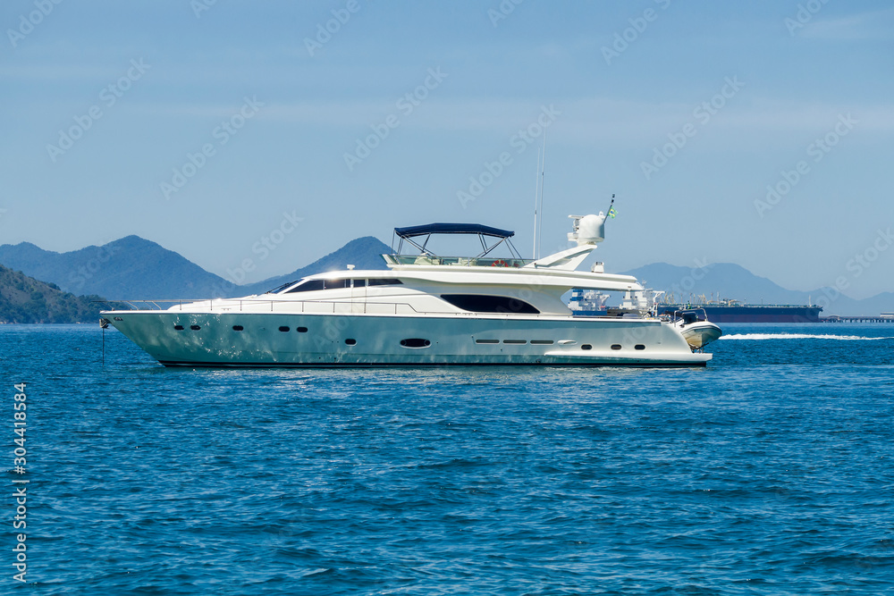 Yatch under blue sky in sunny day in Angra dos Reis, Rio de Janeiro, Brazil