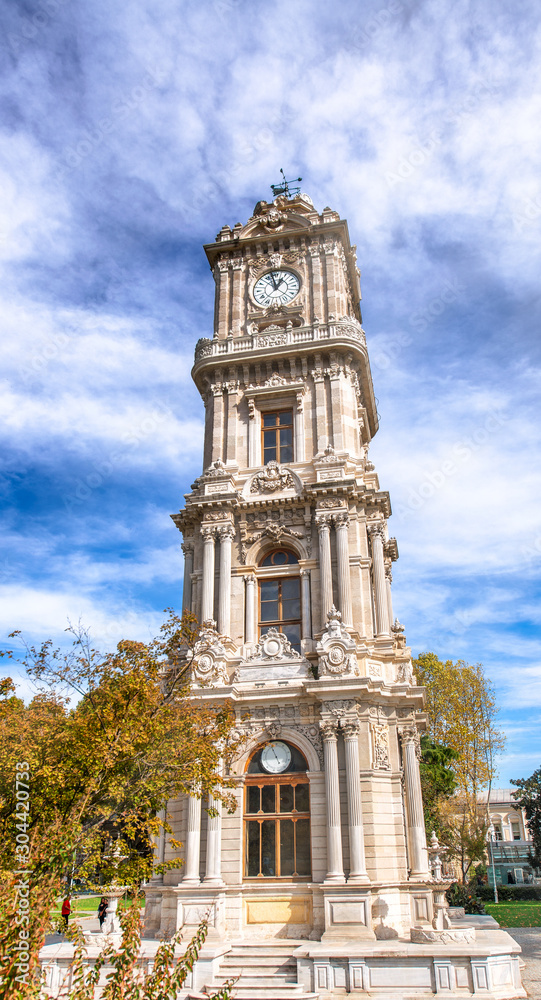 Dolmabahce Saat Kulesi in Istanbul. The clock tower is located at the entry of the Dolmabahce Palace