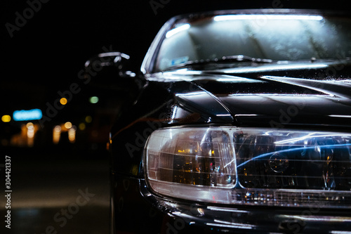 Carwash night time black car and lamp illumination © Vivid Cafe