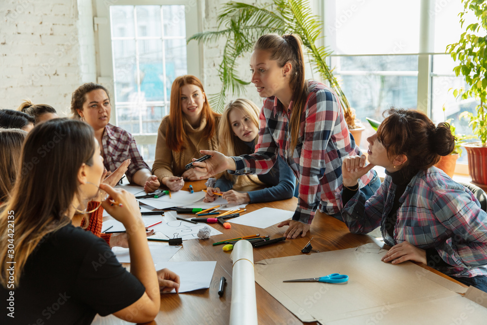 Obraz premium Teamwork. Young people discussing about women rights and equality at the office. Caucasian businesswomen or office workers have meeting about problem in workplace, male pressure and harassment.