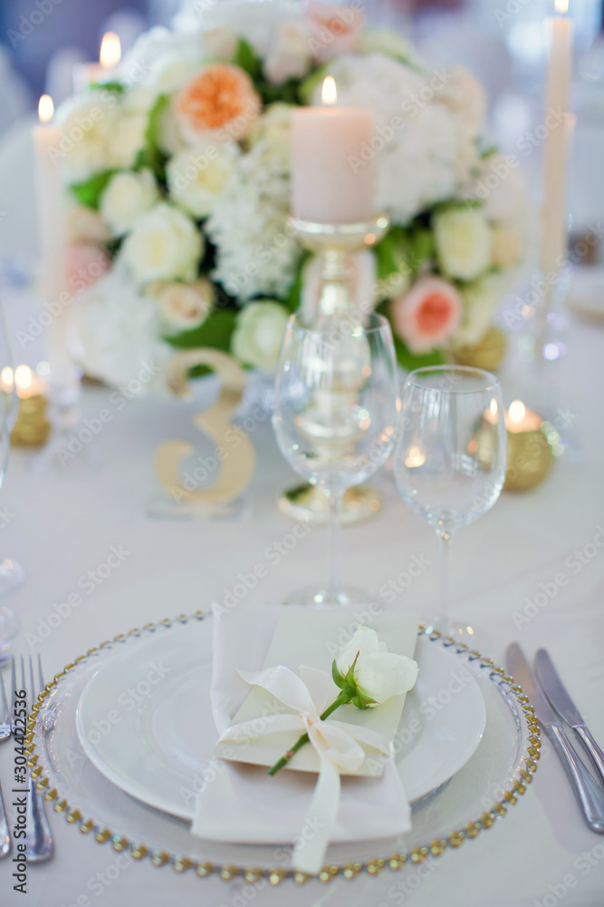 Beautiful table setting with white flowers Beautiful table setting with white flowers